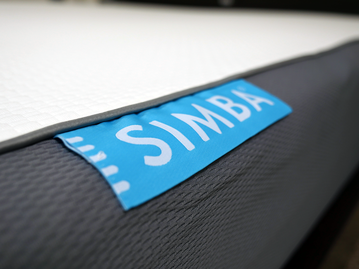 Close up shot of the Simba mattress logo